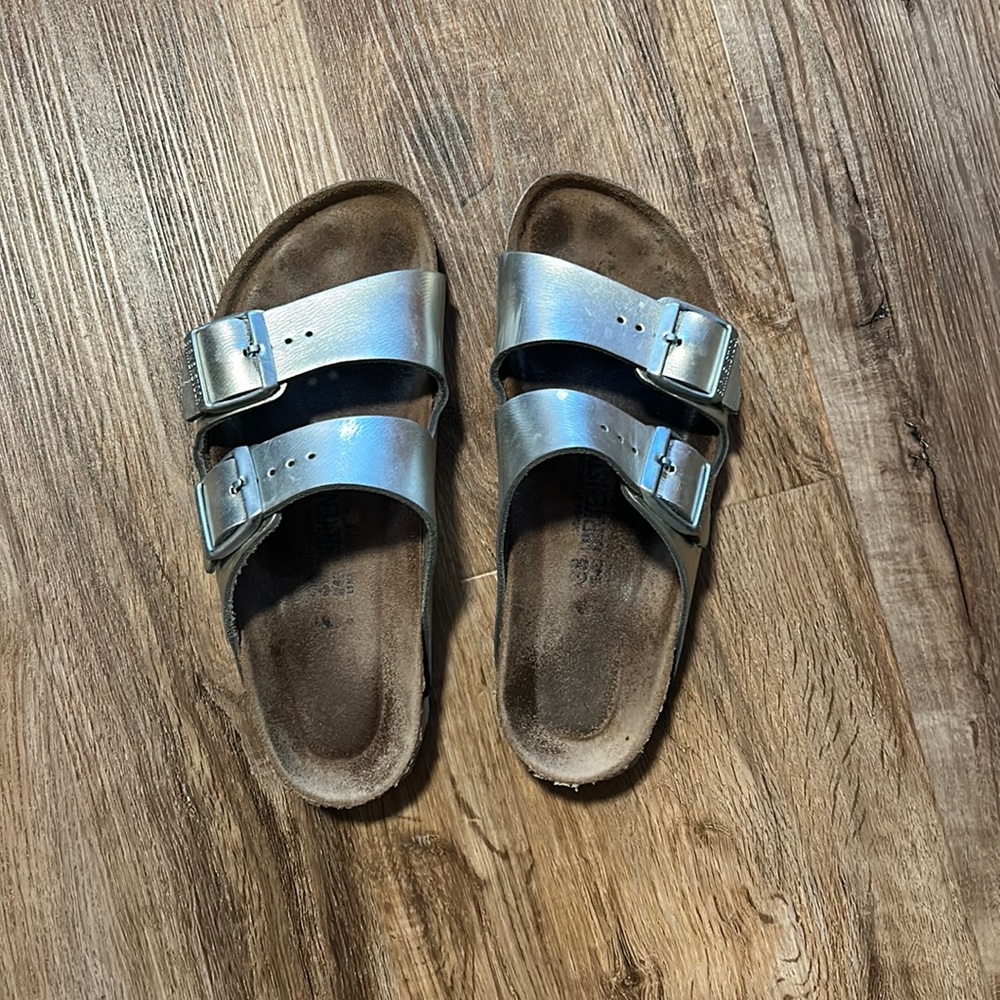 Well loved size 38 metallic silver Arizona Birkenstocks.I normally wear a size 8
